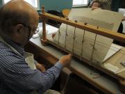 The late Chris Clarkson sewing the folios The late Chris Clarkson sewing the folios
