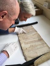 Examining a mid-14th century Roll. Courtesy of Doncaster Archives