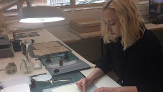 Rebecca Dabnor working on the collection.